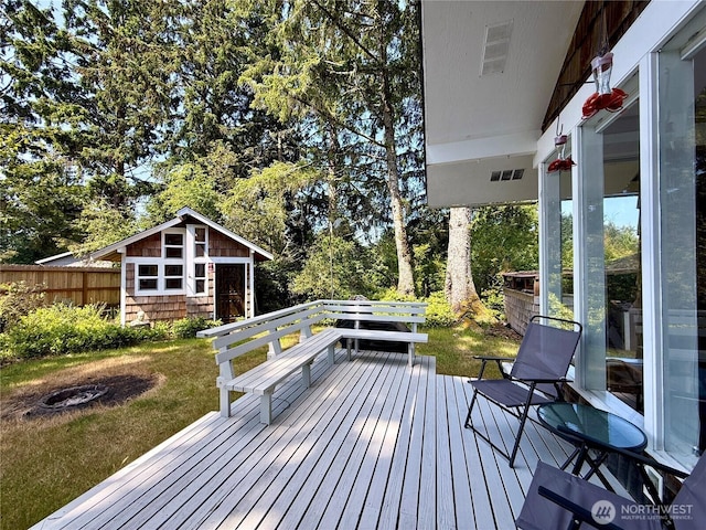 877 Mount Olympus Ave SE, Ocean Shores, WA 98569 - deck featuring an outdoor structure and view of scattered trees