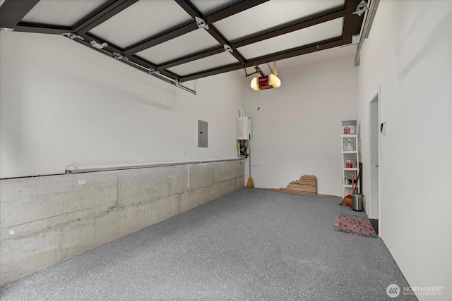 1110 Martin Luther King Jr Way S Unit A, Seattle, WA 98144 - garage featuring a garage door opener, electric panel, and tankless water heater