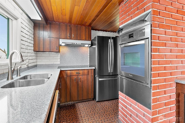 29432 59th Ave S, Auburn, WA 98001 - kitchen featuring under cabinet range hood, stainless steel appliances, wood ceiling, light countertops, and brown cabinets