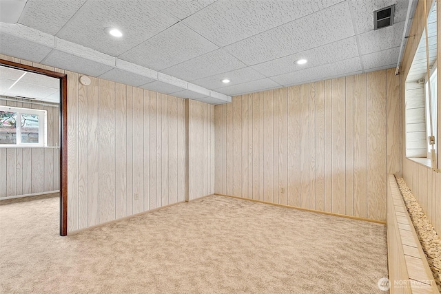 29432 59th Ave S, Auburn, WA 98001 - spare room featuring a drop ceiling, wood walls, carpet, recessed lighting, and radiator