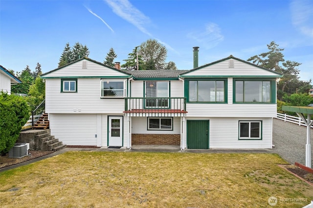 29432 59th Ave S, Auburn, WA 98001 - back of house with stairs, a lawn, and brick siding