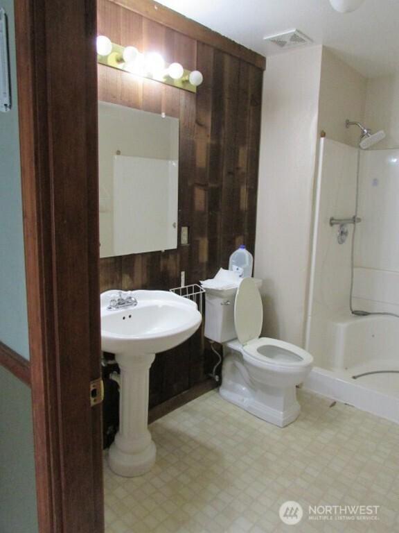 725 W Main, Morton, WA 98356 - full bath featuring a shower stall and tile patterned floors