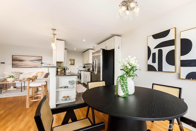 11515 Greenwood Ave N Unit C, Seattle, WA 98133 - dining room featuring light wood-style floors, a chandelier, and recessed lighting