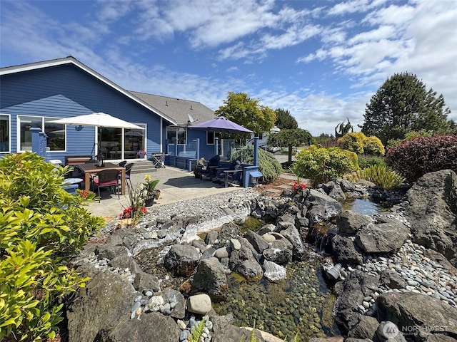 206 Buckhorn, Sequim, WA 98382 - back of property featuring a patio area