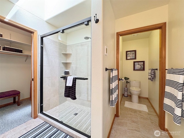 206 Buckhorn, Sequim, WA 98382 - bathroom featuring a stall shower and a spacious closet