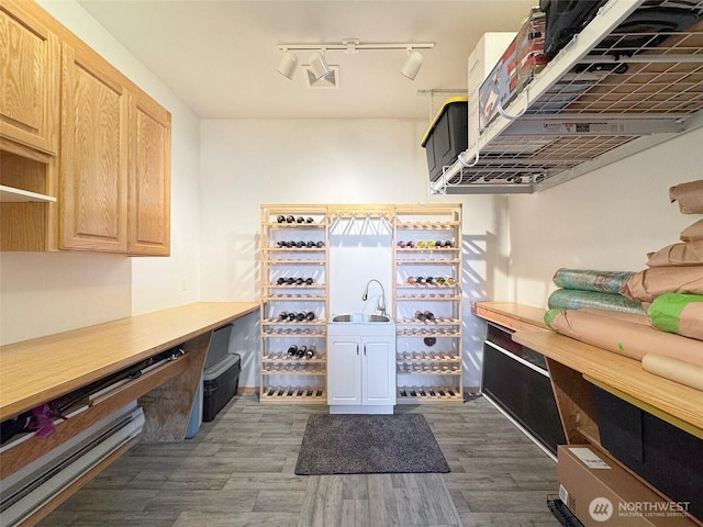 206 Buckhorn, Sequim, WA 98382 - kitchen with dark wood finished floors, track lighting, and light brown cabinets