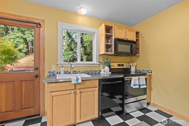 13527 23rd Ave NE, Seattle, WA 98125 - kitchen with black appliances, dark flooring, light brown cabinetry, and plenty of natural light
