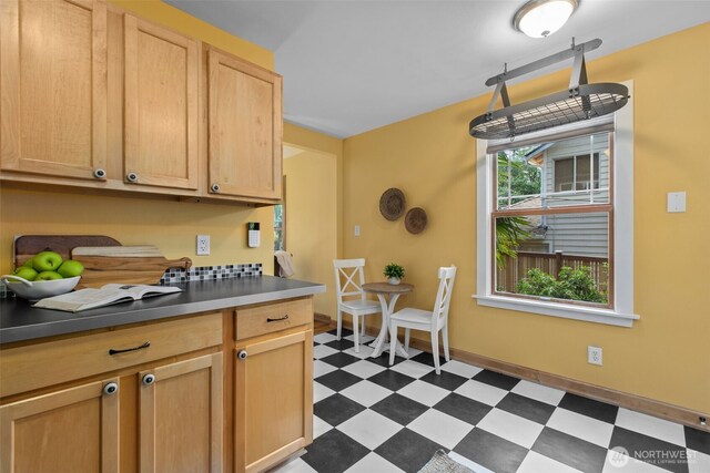 13527 23rd Ave NE, Seattle, WA 98125 - kitchen with dark flooring and light brown cabinetry