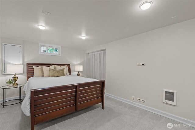 13527 23rd Ave NE, Seattle, WA 98125 - carpeted bedroom featuring heating unit and baseboards