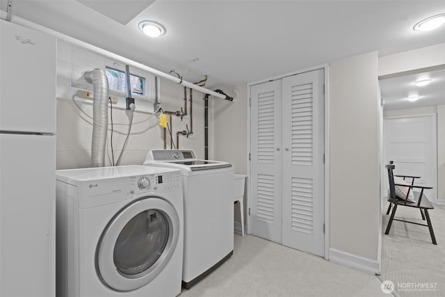 13527 23rd Ave NE, Seattle, WA 98125 - laundry area featuring separate washer and dryer and baseboards