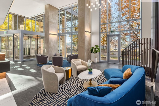 800 Columbia St Unit 708, Seattle, WA 98104 - common area with a high ceiling and floor to ceiling windows