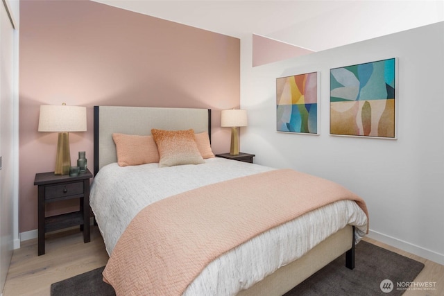 800 Columbia St Unit 1009, Seattle, WA 98104 - bedroom featuring wood finished floors