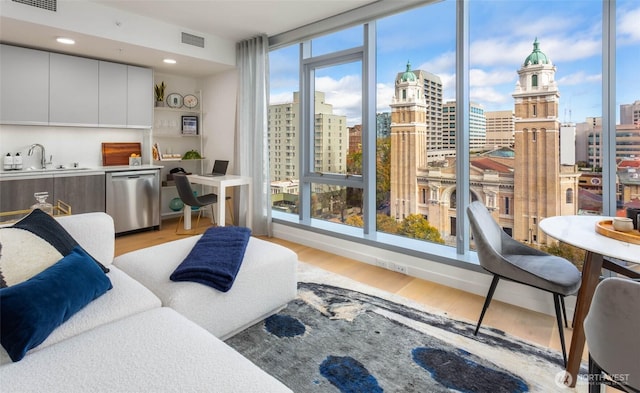 800 Columbia St Unit 1708, Seattle, WA 98104 - living room with a view of city and light wood finished floors