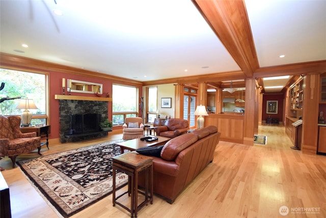 133 Fairway Pl, Sequim, WA 98382 - living area featuring a stone fireplace, light wood finished floors, and crown molding