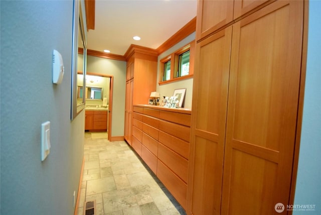 133 Fairway Pl, Sequim, WA 98382 - hallway featuring crown molding, stone finish floors, and recessed lighting