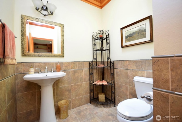 133 Fairway Pl, Sequim, WA 98382 - bathroom featuring tile walls and wainscoting