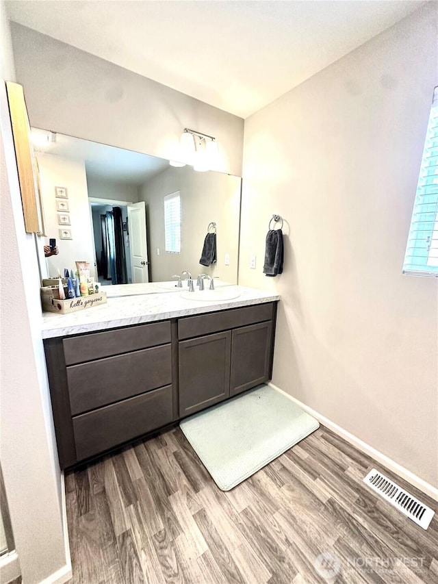 9151 Viola St SE, Tumwater, WA 98501 - bathroom with wood finished floors and vanity