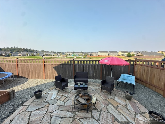 9151 Viola St SE, Tumwater, WA 98501 - fenced backyard with a residential view, a patio area, and a fire pit