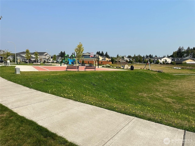 9151 Viola St SE, Tumwater, WA 98501 - view of community featuring community basketball court, a lawn, and a residential view