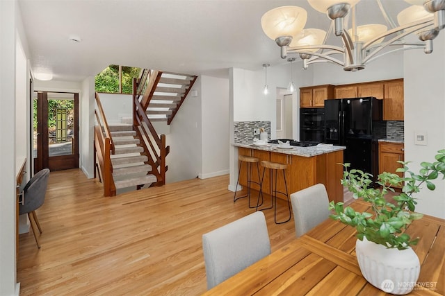 1820 NE 177th St, Shoreline, WA 98155 - dining area featuring stairway, light wood-style flooring, and a chandelier