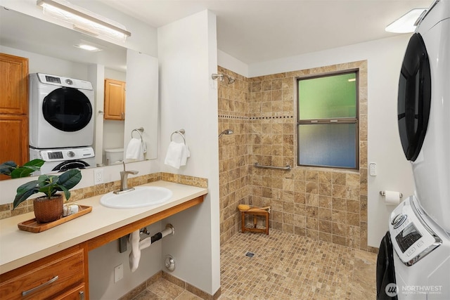 1820 NE 177th St, Shoreline, WA 98155 - full bath with stacked washing machine and dryer, a tile shower, and vanity