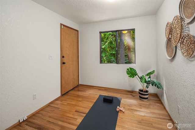 1820 NE 177th St, Shoreline, WA 98155 - workout area featuring light wood-type flooring and a textured wall