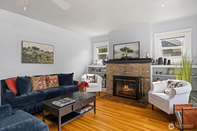 12 Newell St, Walla Walla, WA 99362 - living room with wood finished floors, a fireplace, and ceiling fan