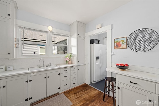 12 Newell St, Walla Walla, WA 99362 - kitchen featuring white fridge with ice dispenser, dark wood-style floors, and light countertops