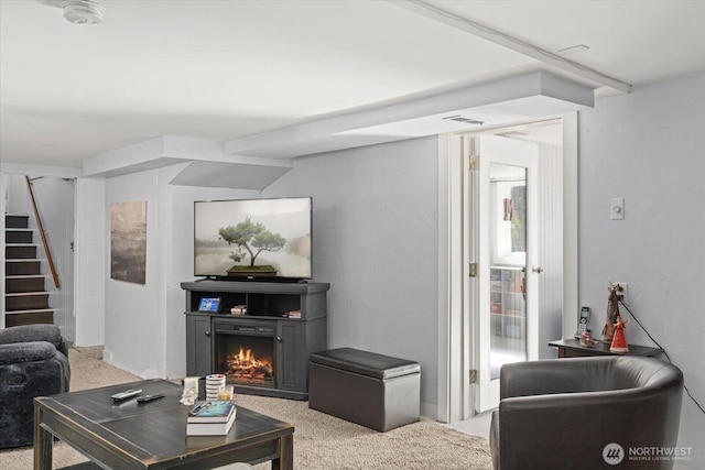 12 Newell St, Walla Walla, WA 99362 - living area featuring stairway, light carpet, and a warm lit fireplace
