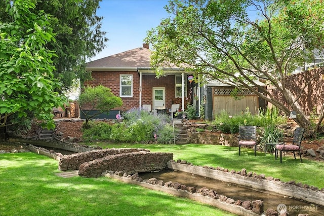 12 Newell St, Walla Walla, WA 99362 - view of front of home featuring brick siding, a shingled roof, and a chimney