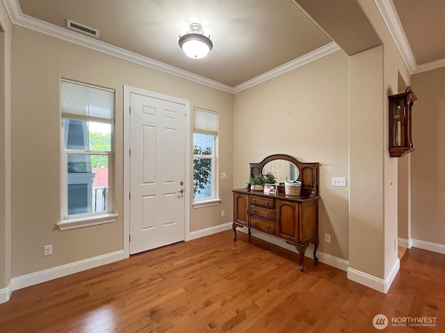 8621 Bainbridge Loop NE, Lacey, WA 98516 - entrance foyer featuring wood finished floors and ornamental molding