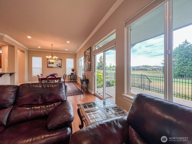 8621 Bainbridge Loop NE, Lacey, WA 98516 - living room featuring a chandelier, light wood-type flooring, crown molding, and recessed lighting
