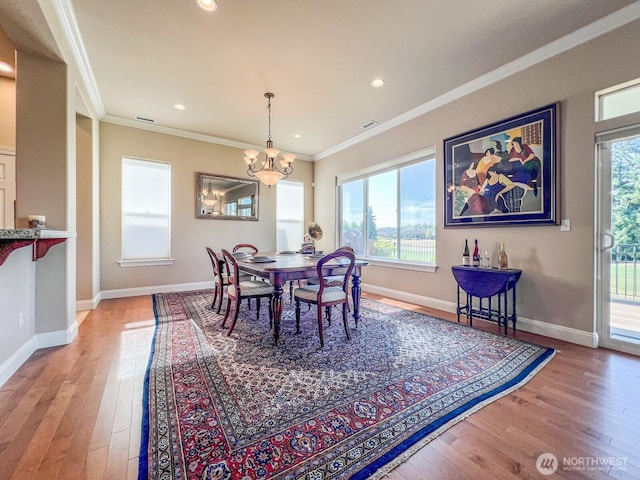 8621 Bainbridge Loop NE, Lacey, WA 98516 - dining room with wood finished floors, crown molding, a chandelier, and recessed lighting
