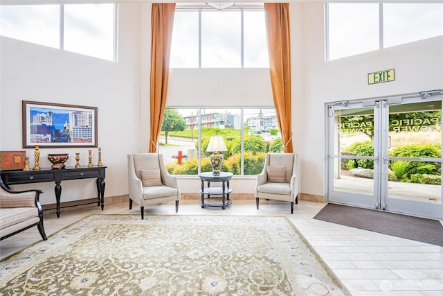 3201 Pacific Ave Unit 403, Tacoma, WA 98418 - living area featuring a towering ceiling and tile patterned floors