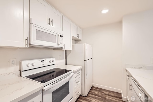 14760 NE 31st St Unit A105, Bellevue, WA 98007 - kitchen featuring white appliances, dark wood-style flooring, white cabinets, light stone countertops, and recessed lighting