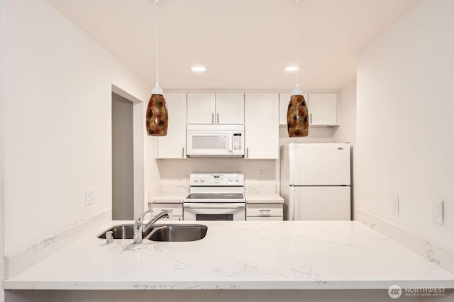 14760 NE 31st St Unit A105, Bellevue, WA 98007 - kitchen with white appliances, white cabinetry, recessed lighting, pendant lighting, and light stone counters