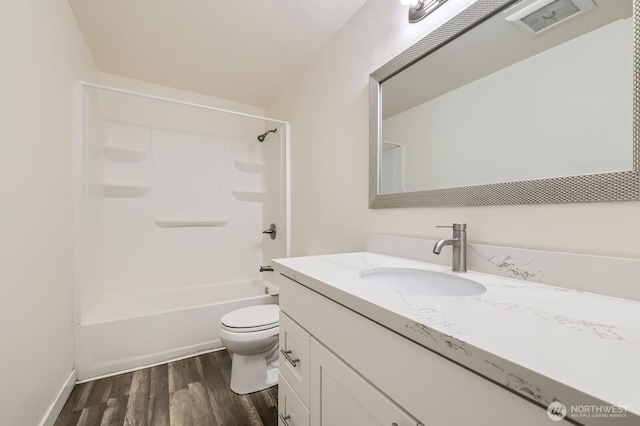 14760 NE 31st St Unit A105, Bellevue, WA 98007 - full bathroom with vanity, wood finished floors, and washtub / shower combination