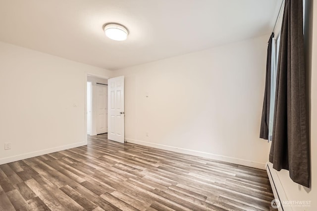 14760 NE 31st St Unit A105, Bellevue, WA 98007 - spare room featuring wood finished floors and baseboards
