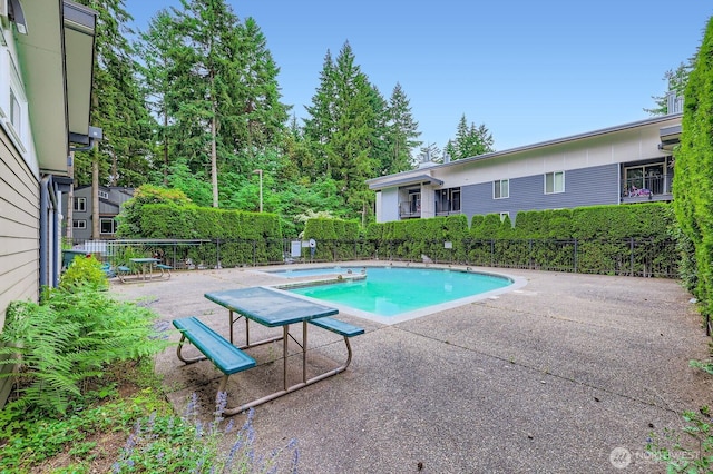 14760 NE 31st St Unit A105, Bellevue, WA 98007 - view of pool with a fenced backyard and a patio
