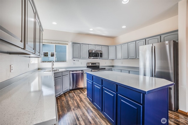 807 Williams St NW, Orting, WA 98360 - kitchen featuring appliances with stainless steel finishes, a center island, recessed lighting, and dark wood-type flooring