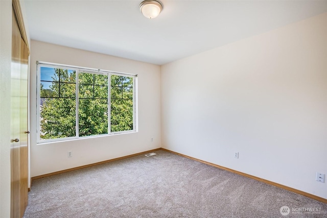 807 Williams St NW, Orting, WA 98360 - empty room with carpet flooring and baseboards