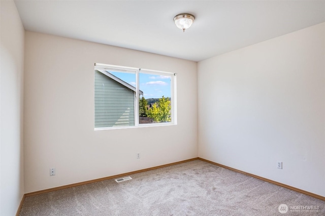 807 Williams St NW, Orting, WA 98360 - carpeted empty room featuring baseboards