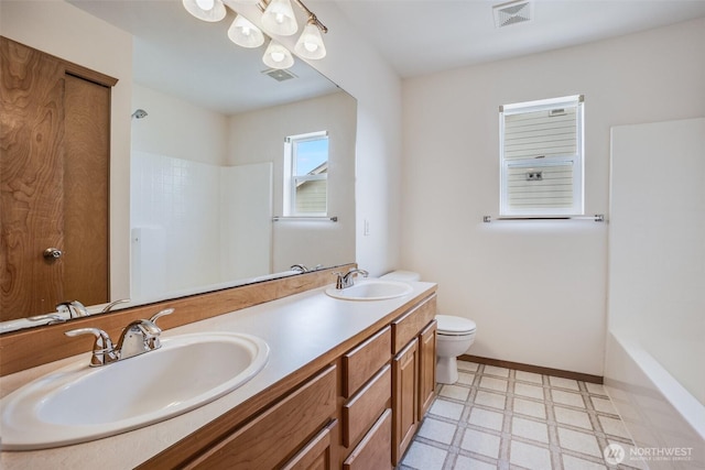 807 Williams St NW, Orting, WA 98360 - full bathroom featuring tile patterned floors and double vanity