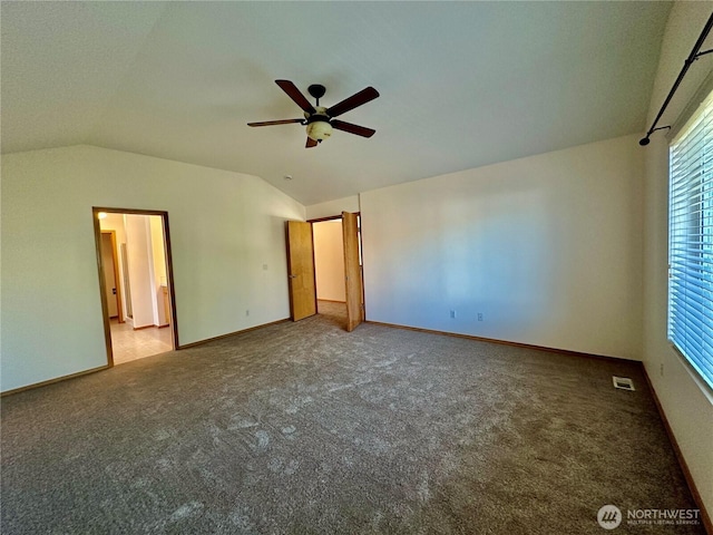 807 Williams St NW, Orting, WA 98360 - unfurnished bedroom with carpet, lofted ceiling, and ceiling fan