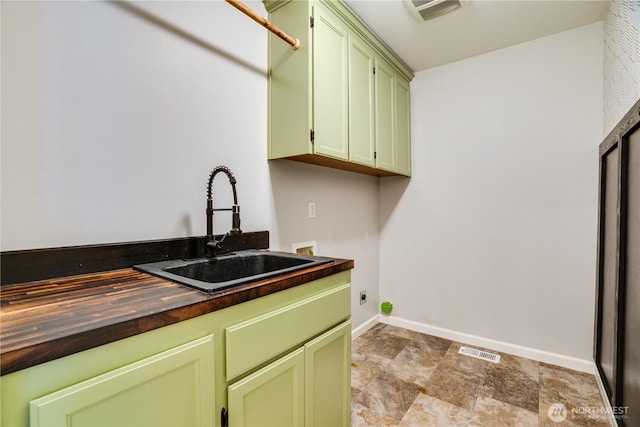 20313 194th Ave E, Orting, WA 98360 - laundry area featuring cabinet space, washer hookup, stone finish flooring, and electric dryer hookup
