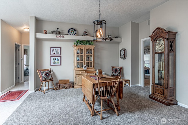 17612 19th Ave E Unit 83, Spanaway, WA 98387 - dining area with carpet and a textured ceiling