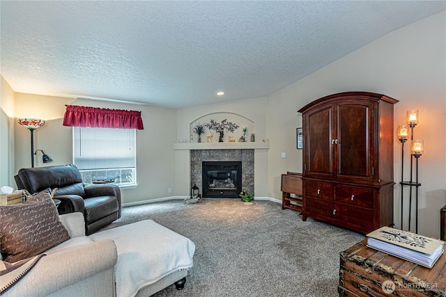 17612 19th Ave E Unit 83, Spanaway, WA 98387 - carpeted living area with a textured ceiling, a tiled fireplace, and recessed lighting