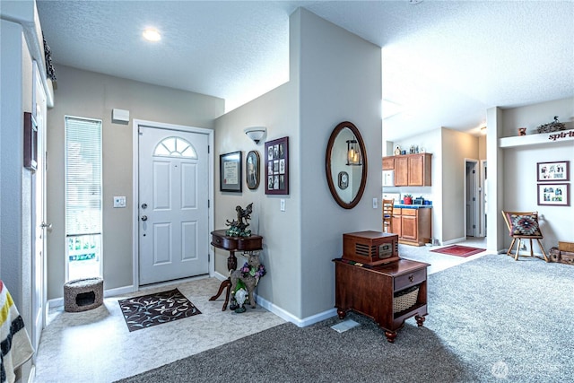 17612 19th Ave E Unit 83, Spanaway, WA 98387 - entrance foyer featuring carpet flooring and a textured ceiling