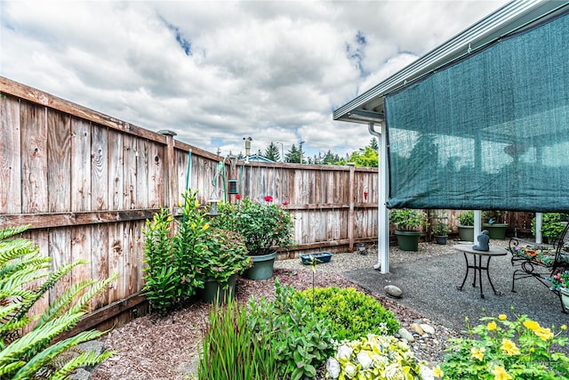 17612 19th Ave E Unit 83, Spanaway, WA 98387 - fenced backyard featuring a patio area
