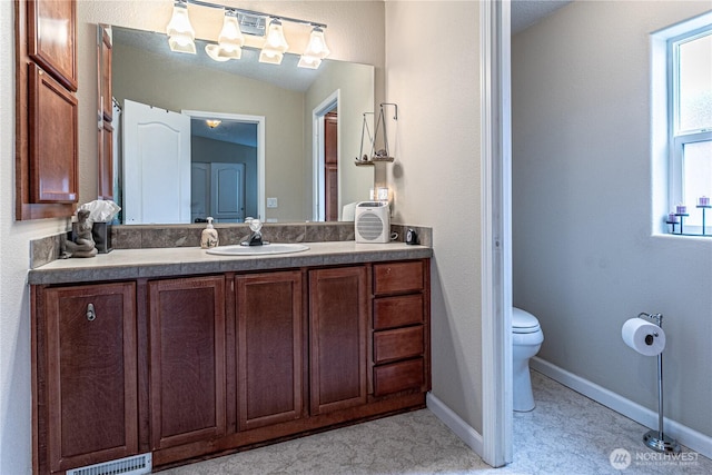 17612 19th Ave E Unit 83, Spanaway, WA 98387 - bathroom featuring toilet and vanity